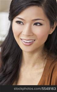 A beautiful young Chinese Asian Oriental woman with a wonderful toothy smile