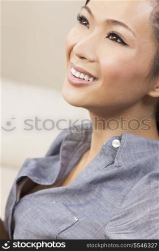 A beautiful young Chinese Asian woman with a wonderful toothy smile