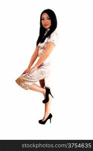 A beautiful young Chinese woman in a long silver dress and long black hairstanding for white background.