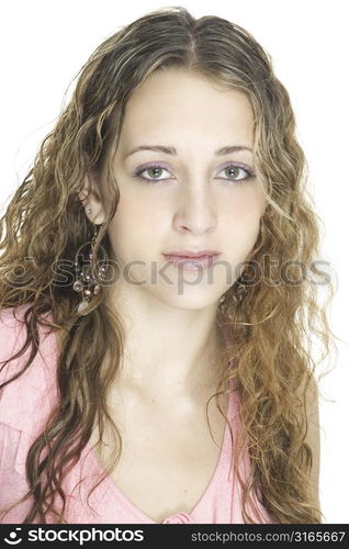 A beautiful young female looks straight at the camera