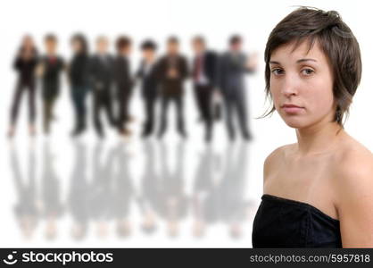 A beautiful young girl in front of a group of people, isolated