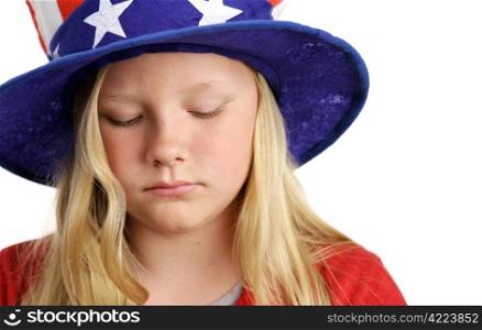 A beautiful young girl wearing a patriotic American hat and looking sad.