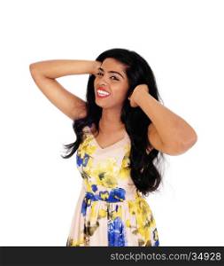 A beautiful young happy woman standing with her hands on her head,waist up, isolated for white background.