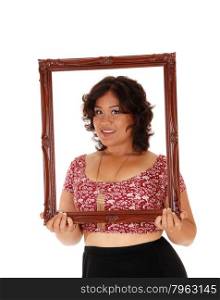 A beautiful young mixed raced woman holding an picture framein front of her, isolated for white background.