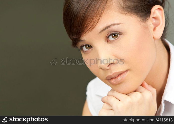 A beautiful young oriental woman looking calm and relaxed