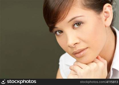 A beautiful young oriental woman looking calm and relaxed