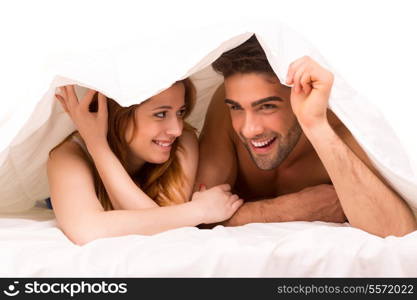 A beautiful young passionate couple in bed