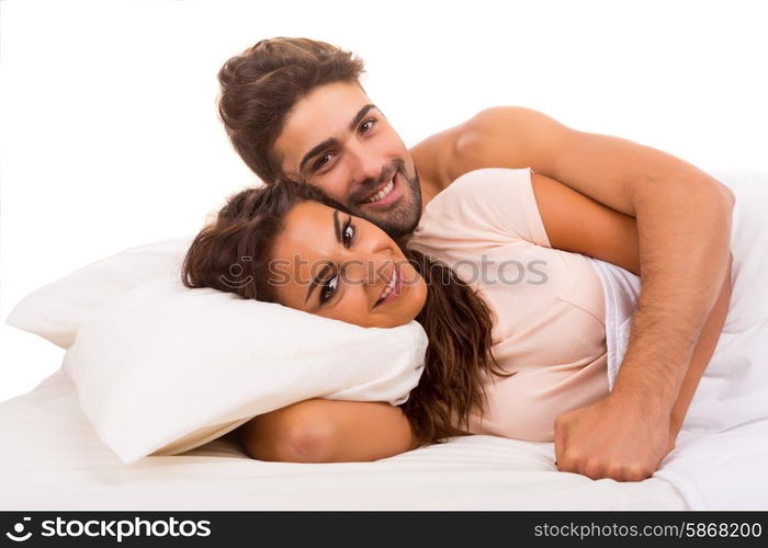 A beautiful young passionate couple in bed