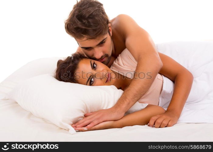 A beautiful young passionate couple in bed