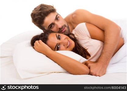 A beautiful young passionate couple in bed