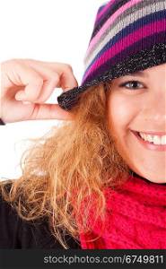 A beautiful young woman dressed for winter, over a white background
