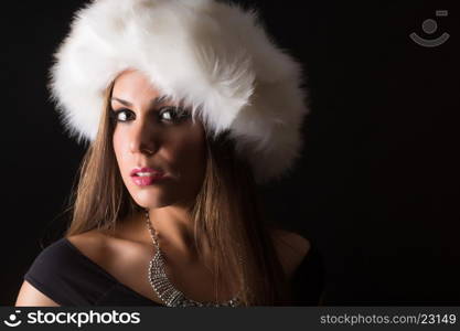 A beautiful young woman dressed with winter clothes