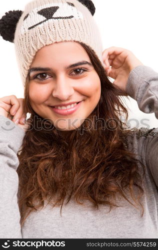 A beautiful young woman dressed with winter clothes