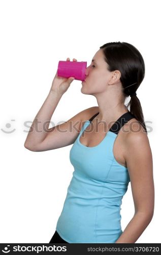 A beautiful young woman drinking juice or milk or water in the morning