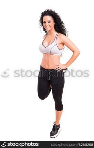 A beautiful young woman exercising - fitness concept