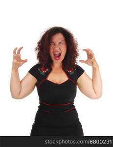 A beautiful young woman in a black dress with her hands up,screaming with open mouth, isolated for white background.
