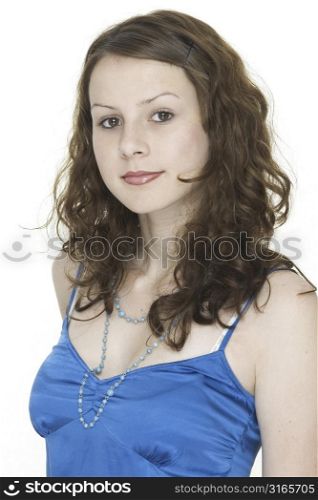 A beautiful young woman in a blue top