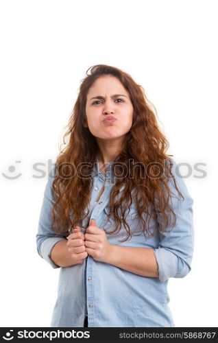 A beautiful young woman making a silly expression, isolated over white