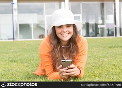 A beautiful young woman relaxing at the city park