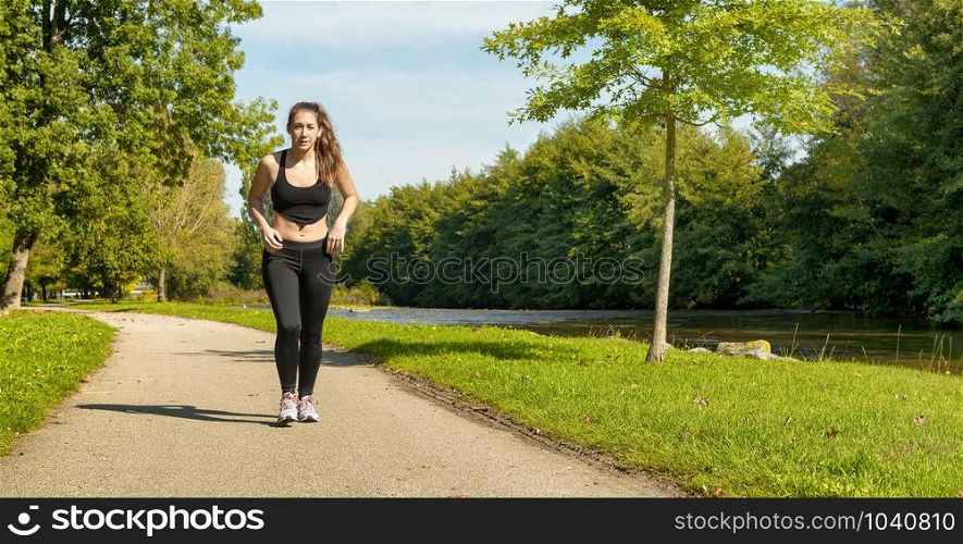 a beautiful young woman run in nature