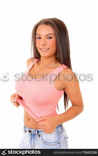 A beautiful young woman standing in a pink t-shirt and jeans, isolatedfor white background.