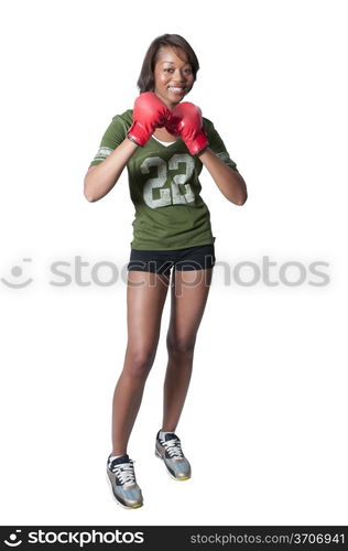 A beautiful young woman wearing a pair of boxing gloves