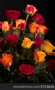A beautifully arranged bouquet of fresh red and yellow roses