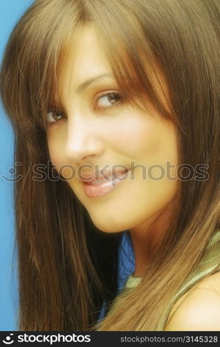 A beauty shot of an attractive woman with straight hair and beautiful youthful skin.