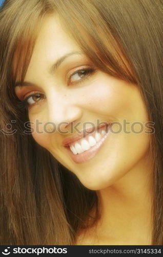A beauty shot of an attractive woman with straight hair and beautiful youthful skin.