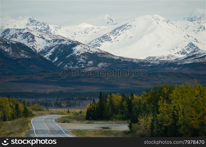 A bend in the road takes you along the base of beautiful Alaska Mountains