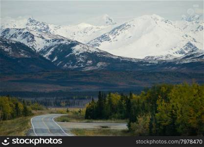 A bend in the road takes you along the base of beautiful Alaska Mountains