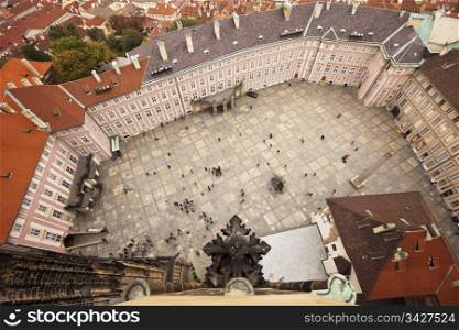 A bird&rsquo;s eye view of the main courtyard at the Prague Castle. Taken from 150 feet up in the belltower of St. Vitus cathedral, details of the tower, various palaces, and government offices are all visible.