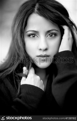 A black and white headshot of a beautiful asian woman