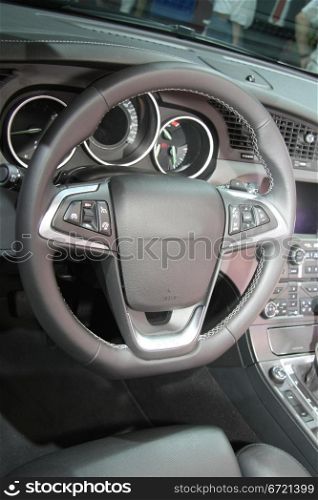 A black leather dashboard of a contemporary car