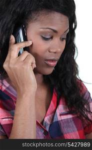 a black woman at phone