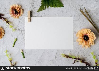 A blank card and flower is placed on white background