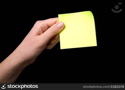 A blank sticky note stuck to a hand - remember this