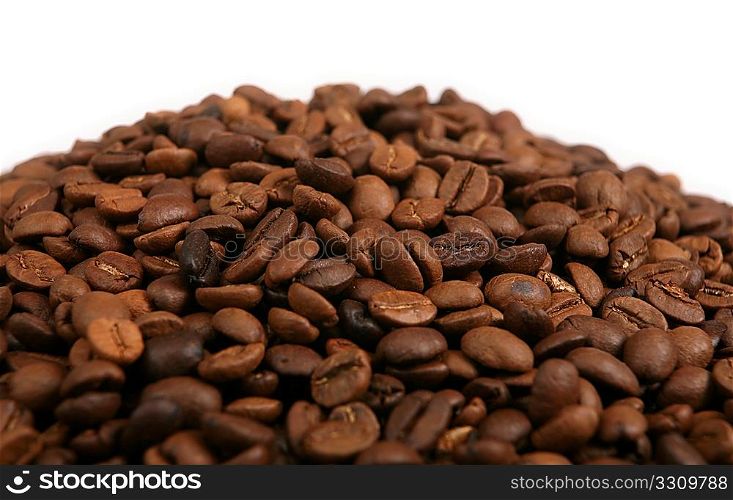 A blend of roasted coffee beans in a heap
