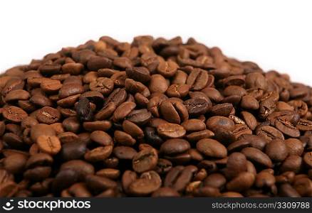 A blend of roasted coffee beans in a heap