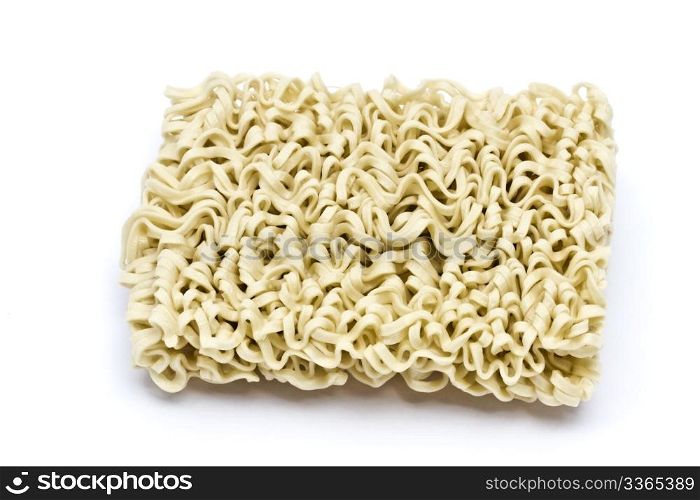 A block of instant noodles closeup on white background