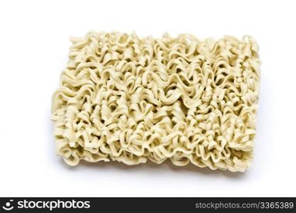 A block of instant noodles closeup on white background