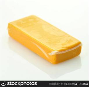 A block of sharp cheddar in a vacuum package