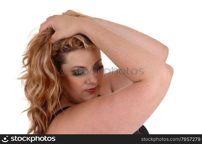 A blond plus size woman holding both her hands on her head and lookingdown, isolated for white background.