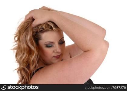 A blond plus size woman holding both her hands on her head and lookingdown, isolated for white background.