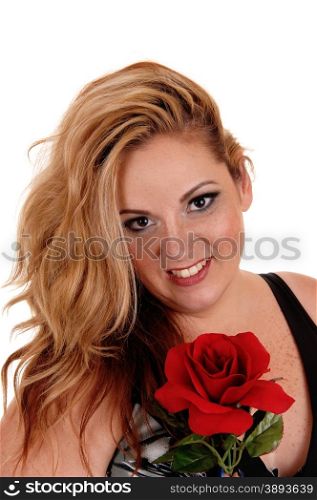 A blond plus size woman in a portrait picture holding a red rose,isolated for white background.