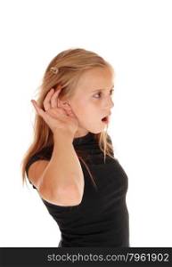 A blond young girl in a black top with one hand behind her ear can nothear well, isolated for white background.