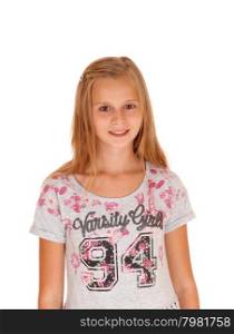 A blond young girl, smiling and standing isolated for white background.