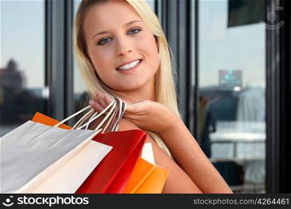 a blonde woman doing shopping
