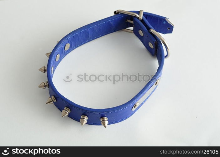 A blue dog collar decorated with spikes