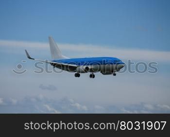 A blue plane just seconds before landing